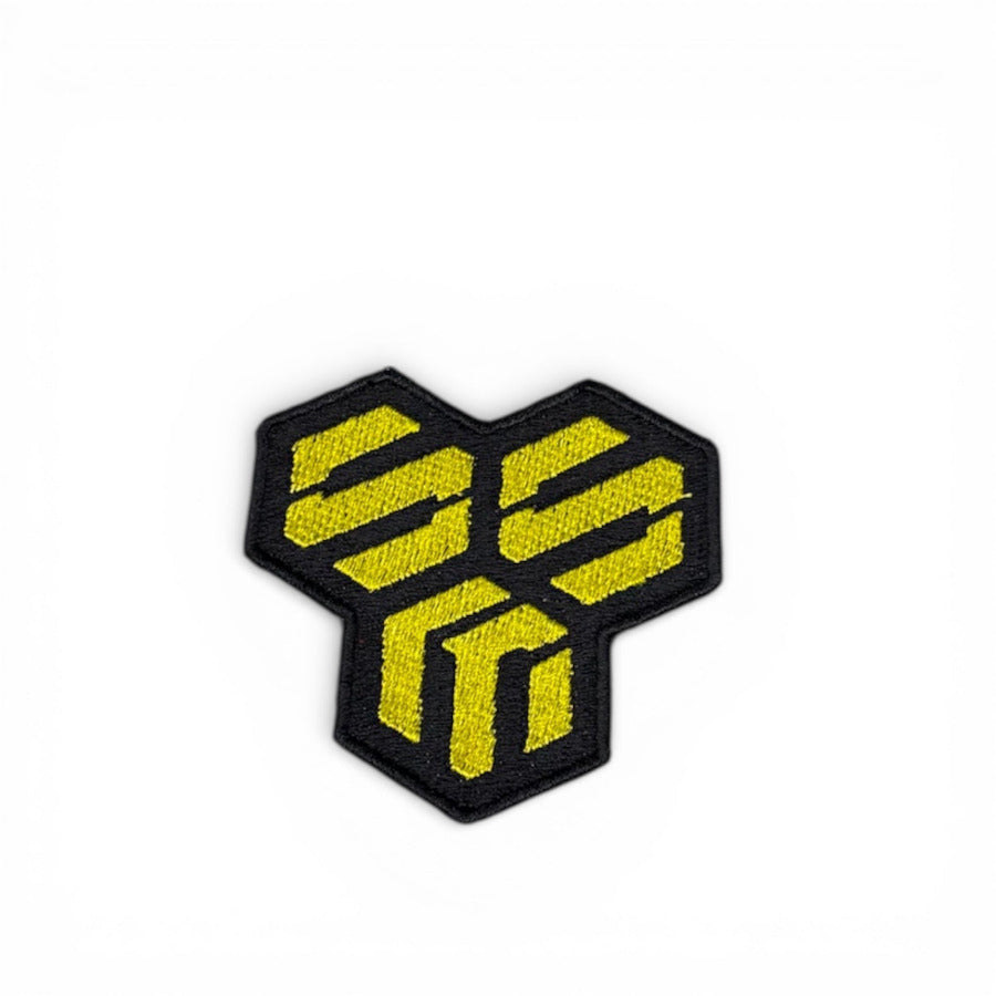 Hexagonal logo with yellow text on a white background